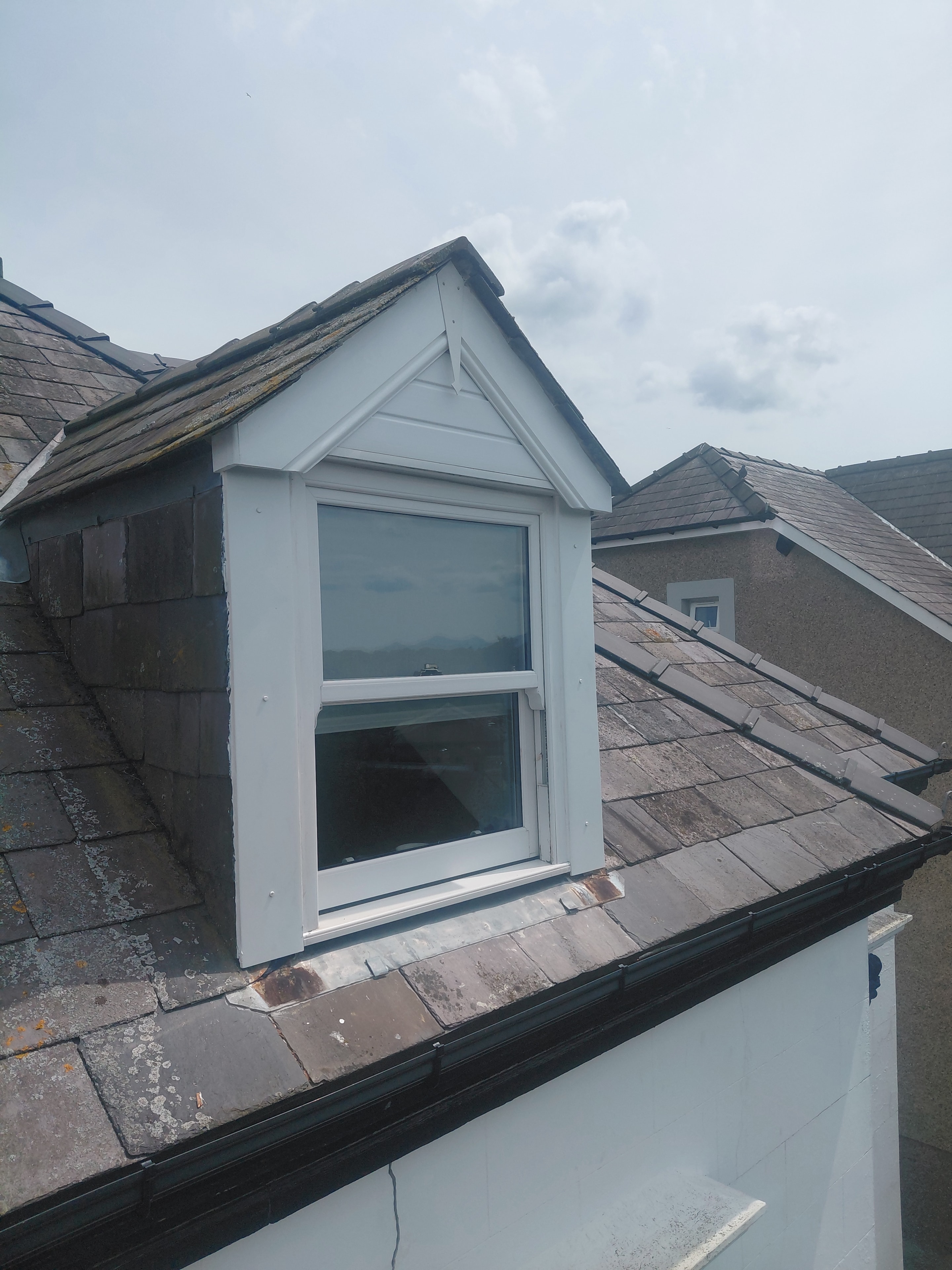 Exterior painting detail — window frame and masonry